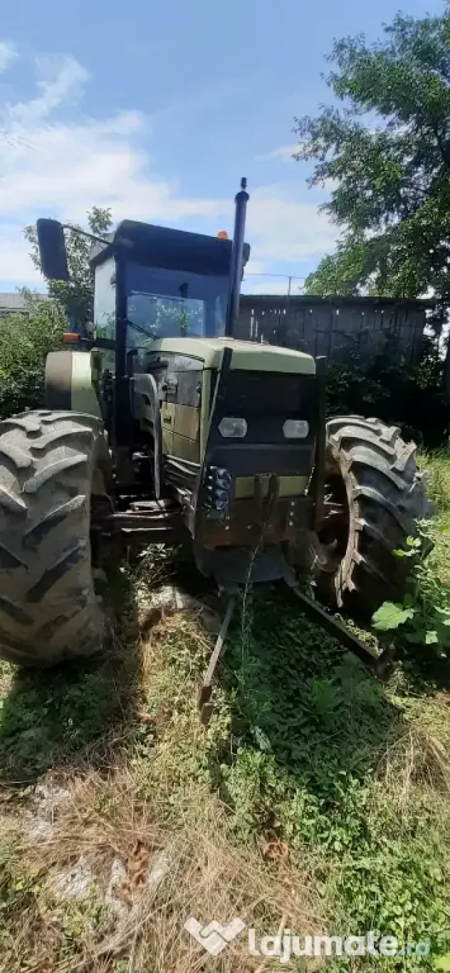 Tractor Hurlimman si plug 4 cormane reversibil