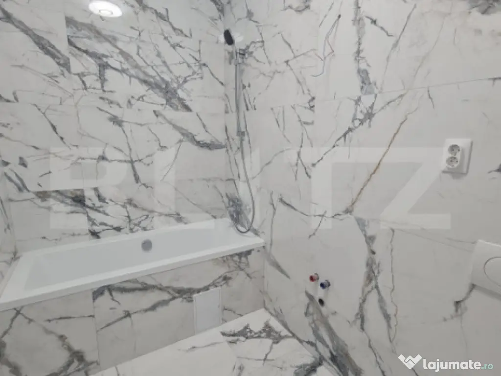 Apartament cu 2 camere, finisaje noi, terasa, parcare subter 