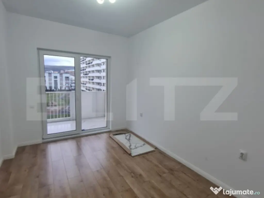 Apartament cu 2 camere, finisaje noi, terasa, parcare subter 