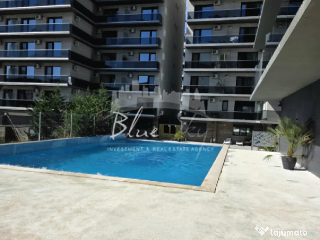Apartament modern cu balcon generos și acces la piscină 