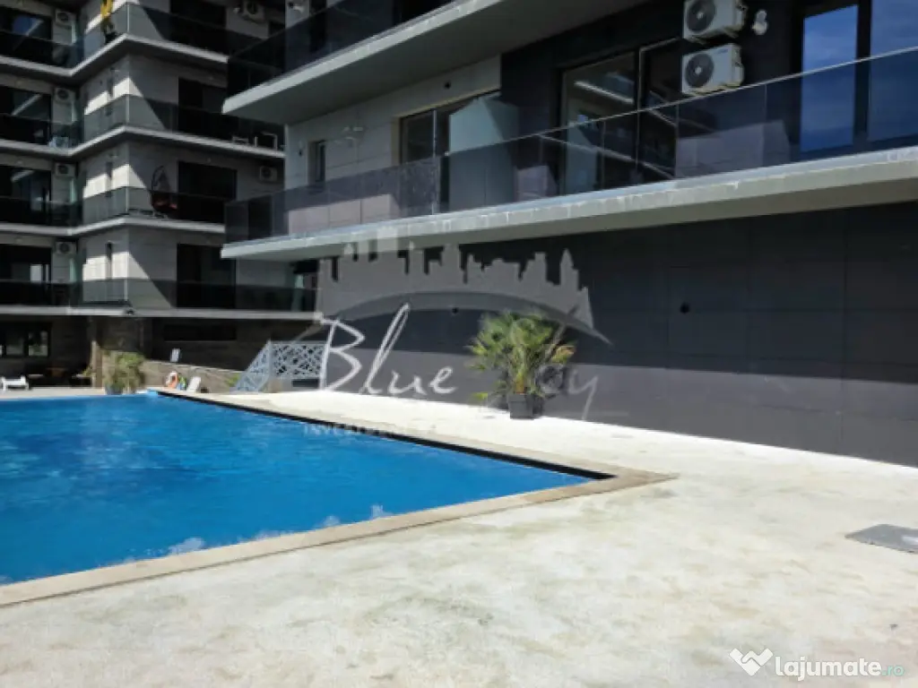 Apartament modern cu balcon generos și acces la piscină 