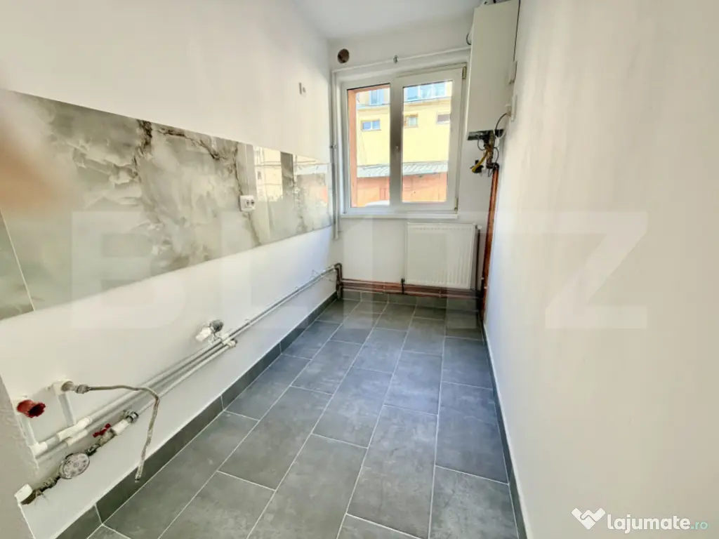Apartament 2 camere,renovat,balcon,parter,zona Centru 