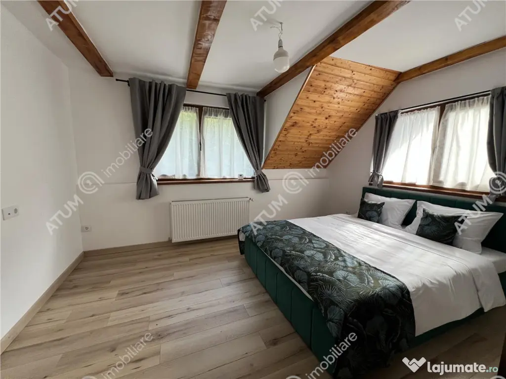 Cabana cu 7 camere 7 bai si teren 1000 mp in Avrig zona Mlac