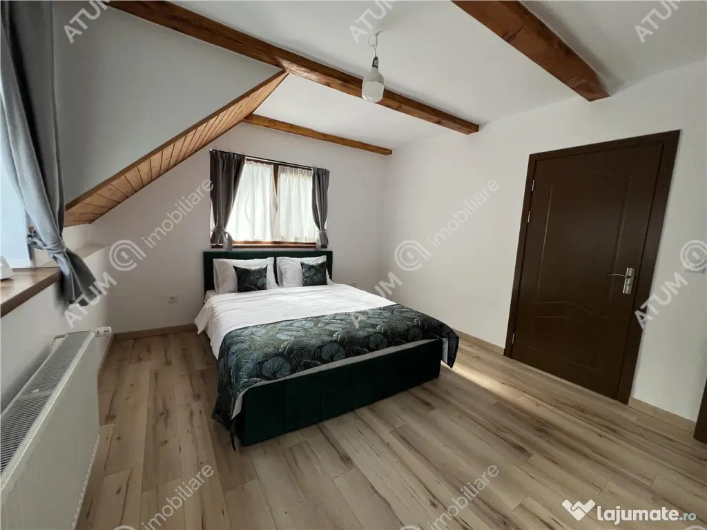 Cabana cu 7 camere 7 bai si teren 1000 mp in Avrig zona Mlac