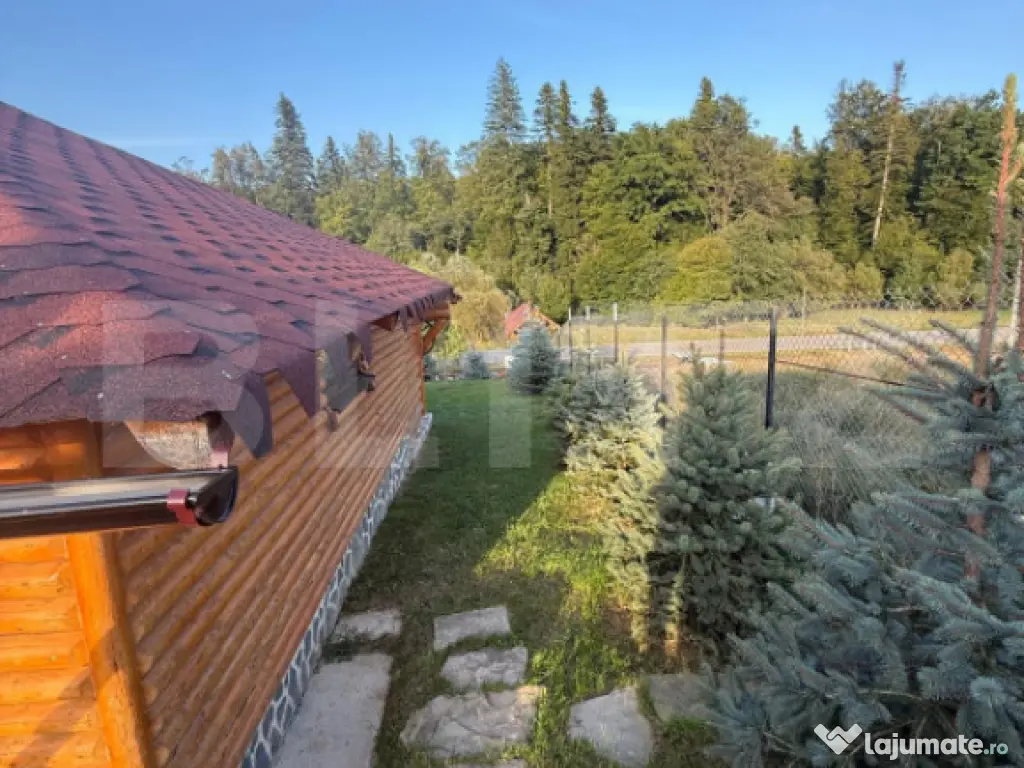 Cabana din lemn rotund, 2 camere, 140 mp, teren 2800 mp, Pal 