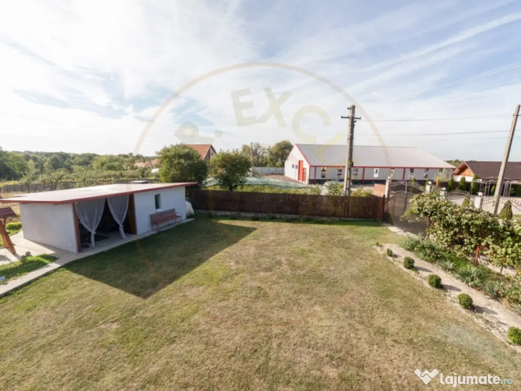Casa cu teren generos si gradina spectaculoasa – Comuna Cu
