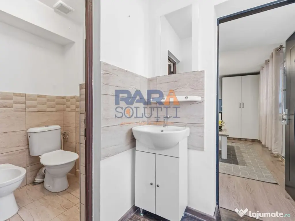 Casă micuță + un pic de curte 