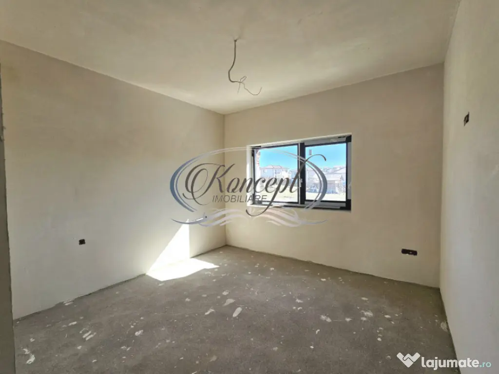 Locuinta moderna cu design cubic si curte plana in Dezmir 