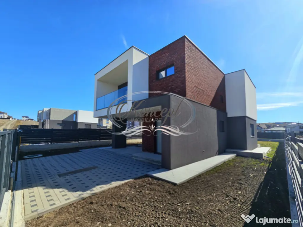 Locuinta moderna cu design cubic si curte plana in Dezmir 