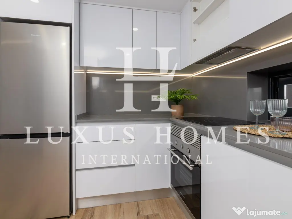 Apartament modern cu piscină comunitară și terasă, situat aproape de plajă 