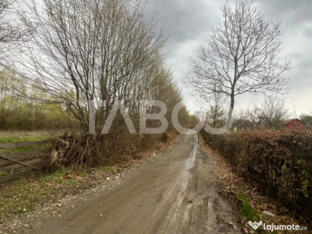 Teren intravilan de vanzare 550m front 21 m utilitati la 120