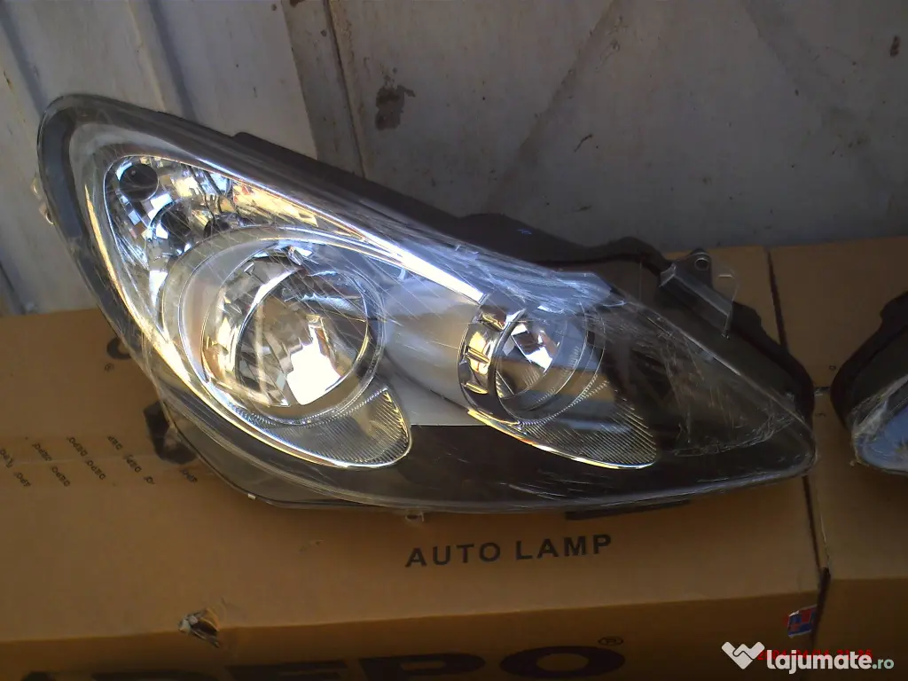 faruri Opel Corsa D fond negru 400 lei 