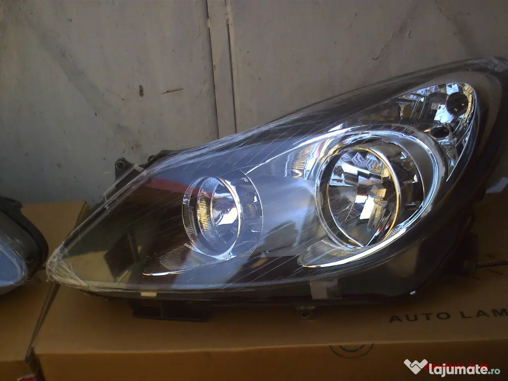 faruri Opel Corsa D fond negru 400 lei 