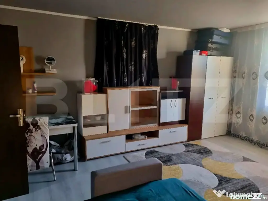 Casă cu 2 camere, renovată, teren generos – liniște la 