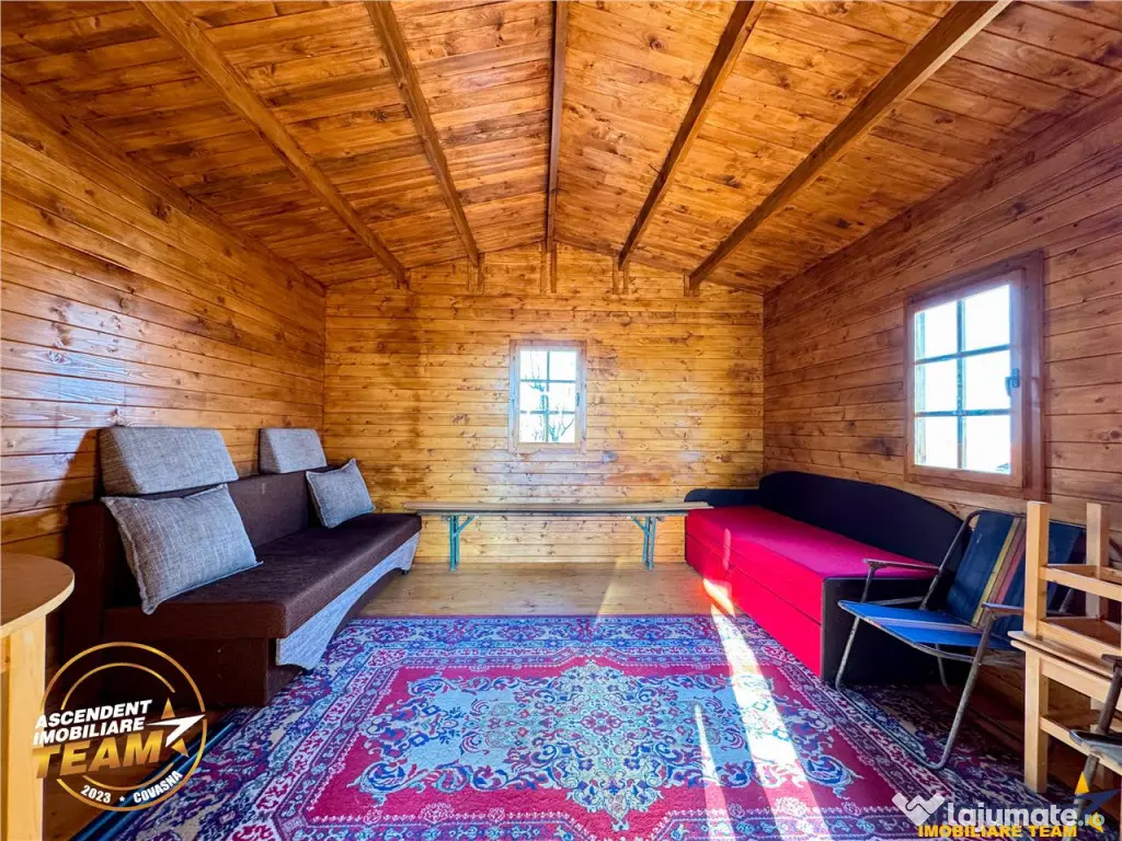 Casuta din lemn,cu 520mp teren intravilan,zona linistita,apr