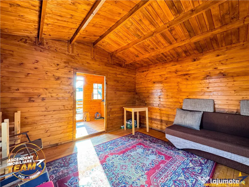 Casuta din lemn,cu 520mp teren intravilan,zona linistita,apr