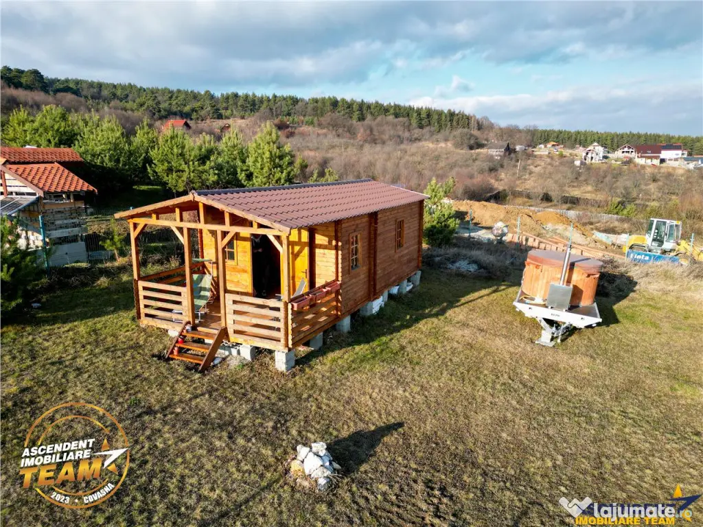 Casuta din lemn,cu 520mp teren intravilan,zona linistita,apr 