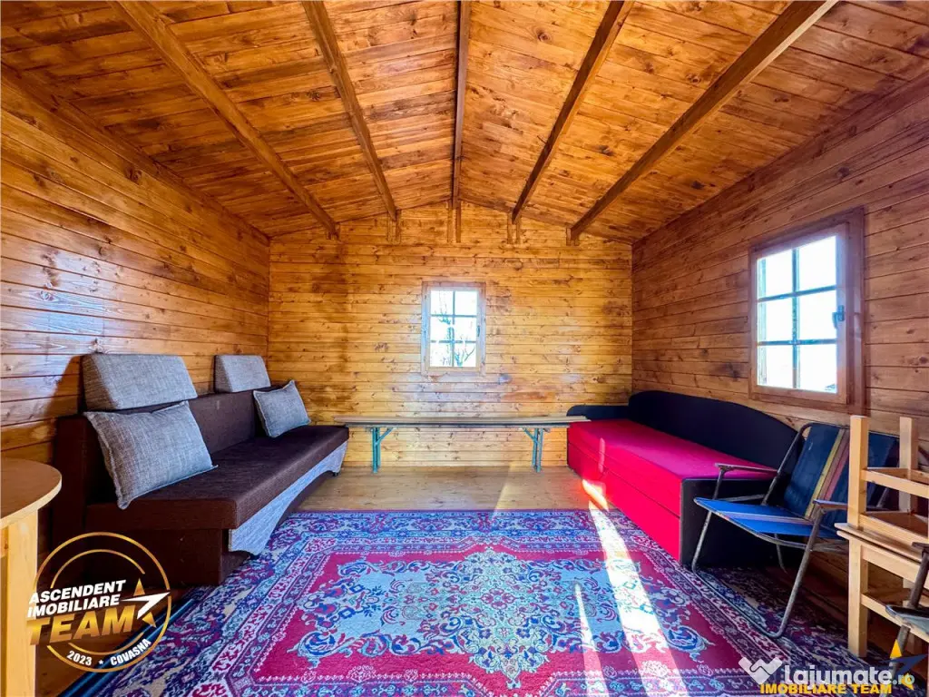 Casuta din lemn,cu 520mp teren intravilan,zona linistita,apr 