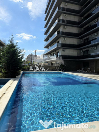Apartament modern cu balcon generos și acces la piscină 