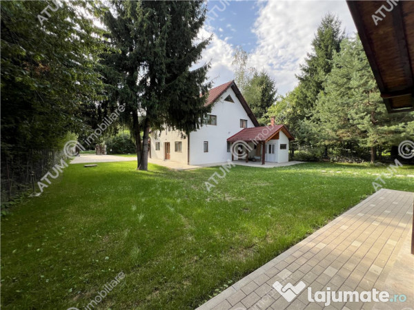 Cabana cu 7 camere 7 bai si teren 1000 mp in Avrig zona Mlac 