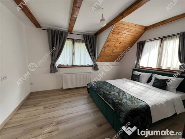 Cabana cu 7 camere 7 bai si teren 1000 mp in Avrig zona Mlac 