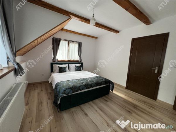 Cabana cu 7 camere 7 bai si teren 1000 mp in Avrig zona Mlac 