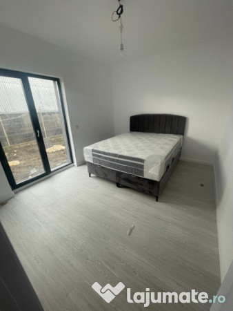 Apartament 2 camere cu curte proprie și 2 locuri de parcare 