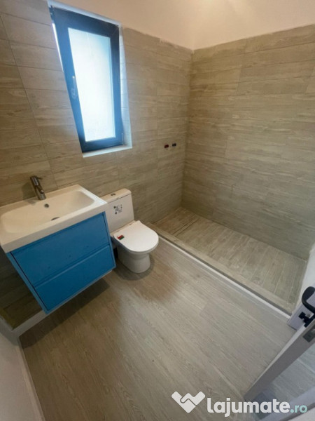 Apartament 2 camere cu curte proprie și 2 locuri de parcare 