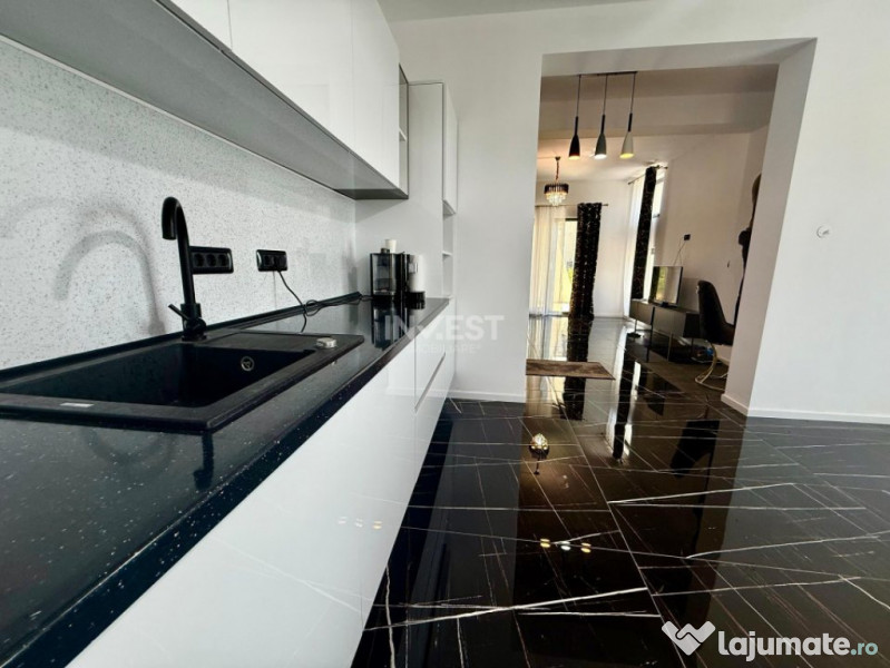 Vilă de vânzare cu design deosebit în cartierul Bucium 