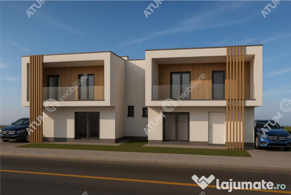 Casa de 4 camere decomandate cu 2 bai si teren de 200 mp in