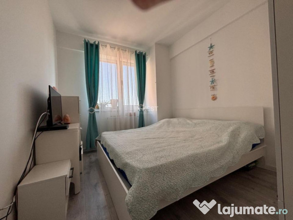APARTAMENT CU 2 CAMERE , OPEN-SPACE, ETAJ INTERMEDIAR, CAPAT 