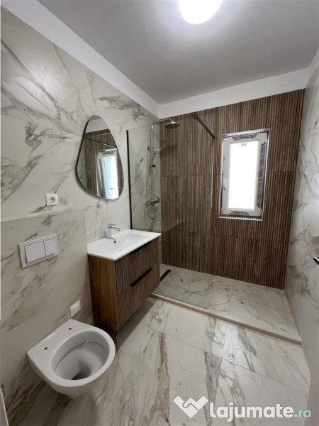 Apartament cu 3 camere 2 bai si balcon etaj 1 zona Doamna St 