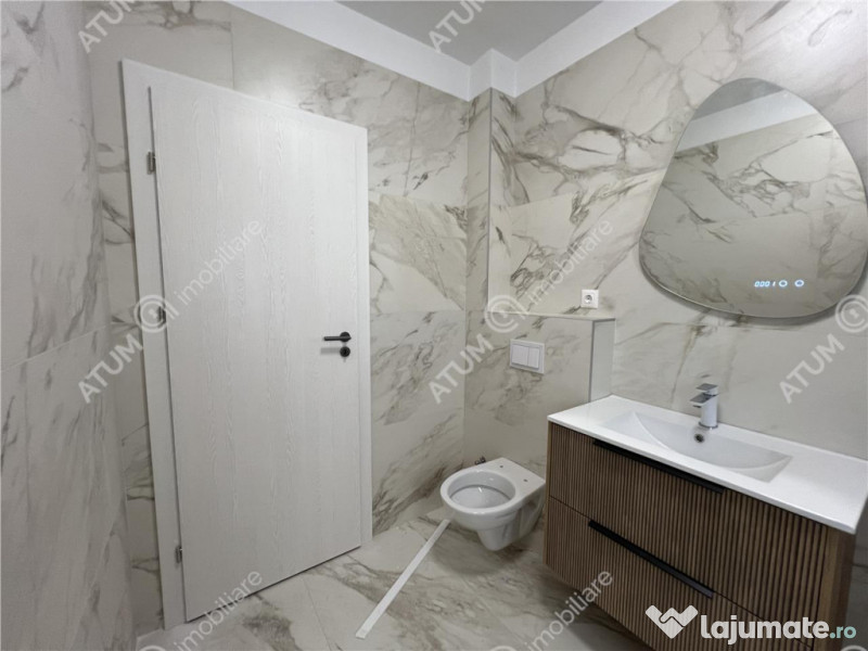 Apartament cu 3 camere 2 bai si balcon etaj 1 zona Doamna St 